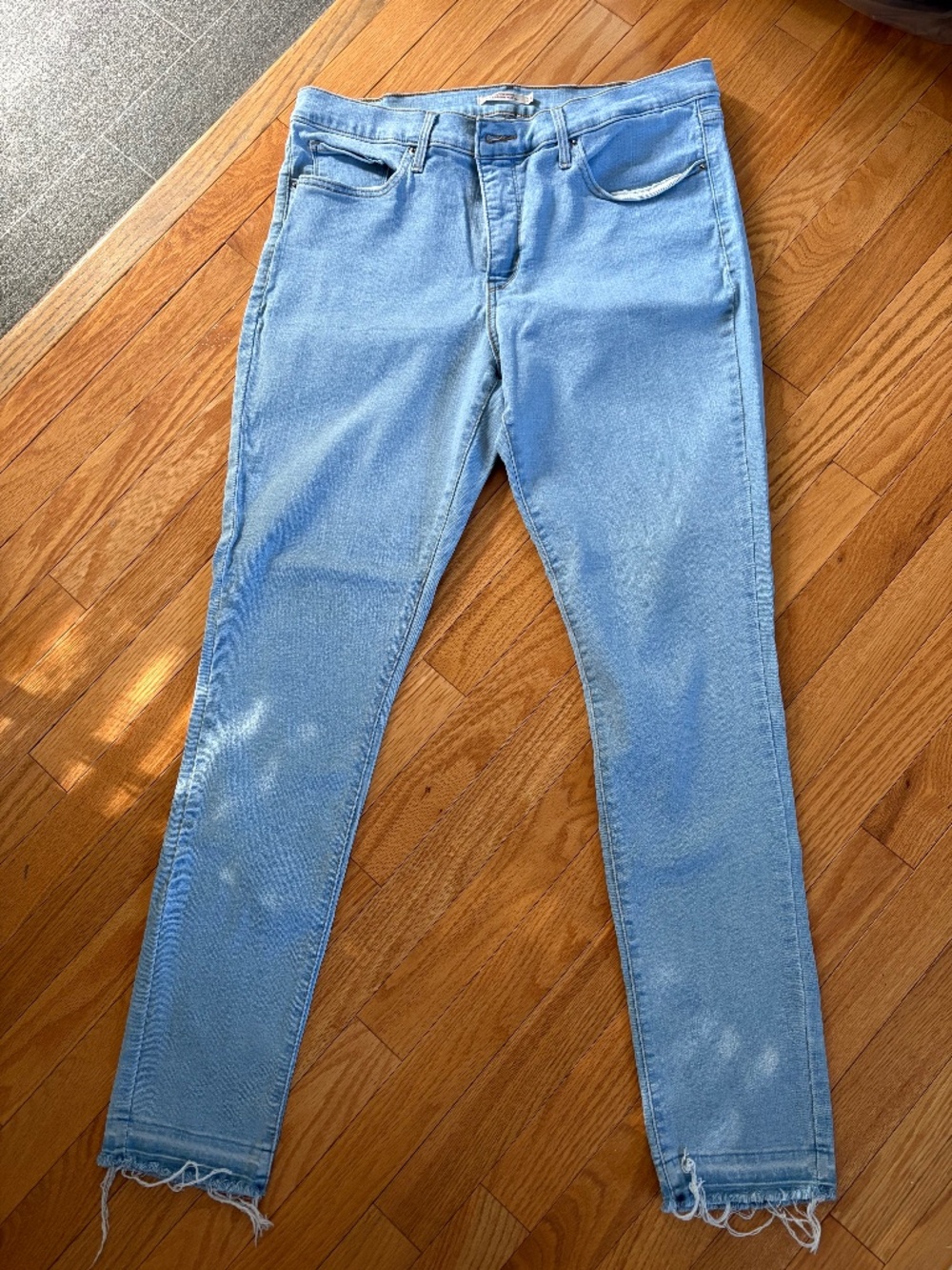 Levi’s 311 Shaping Skinny Jeans Size 34 Light Wash Raw Hem